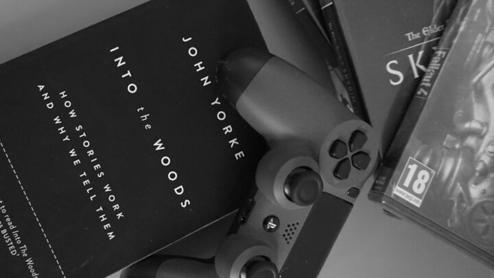 PlayStation controller on top of a copy of John Yorke's Into the Woods article feature